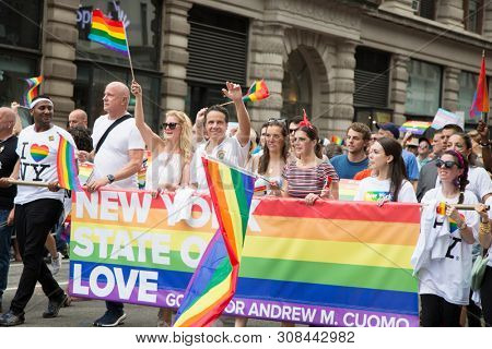 2018 JUNE 24 NEW YORK: Democratic New York Governor Andrew Cuomo and supporters march along the 5th Ave parade route during the NYC Pride March.