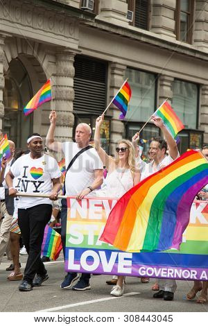 2018 JUNE 24 NEW YORK: Democratic New York Governor Andrew Cuomo and supporters march along the 5th Ave parade route during the NYC Pride March.