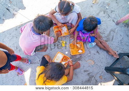 Semporna Borneo - May 11 2019; Hungry Children On This Tiny Idyllic Tropical Island Eagerly Grab And