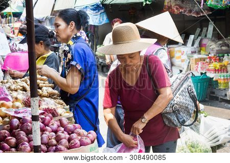 Bangkok, Thailand - 22nd April 2016: Women Shopping For Vegetables In Khlong Toei Wet Market. This I