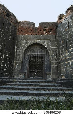 Stone Masonry Wall And Main Gate With Heavy-duty Door At Sardar Purandare Wada, Saswad, Pune.