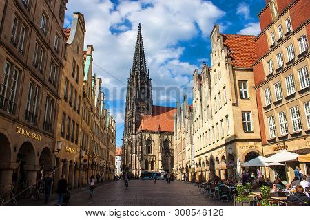 Munster, Germany - May 9: People On Street On May 9, 2013 In Munster, Germany. Largely Destroyed Dur