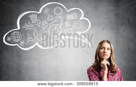 Serious Woman Looks Pensive Upwards And Thinking Something. Speech Bubble With Ecology And Environme