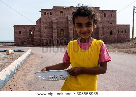 Hormoz, Iran - February 28: Small Poor Girl Sells Shells In Hormoz Village, Iran On February 28, 201