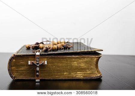 Rosary Beads And Prayer Book. Rosary And Book Of Catholic Church Liturgy.