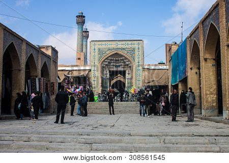 Isfahan, Iran - March 7: People Walk In Front Of Jameh Mosque On March 7, 2013 In Isfahan, Iran. The