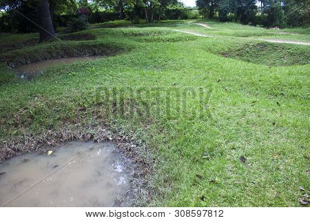 Remnants Of Mass Graves At The Killing Fields Of Choeung Ek, Cambodia
