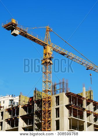 Construction Site Background. Hoisting Crane And New Multi-storey Buildings. I.ndustrial Background.