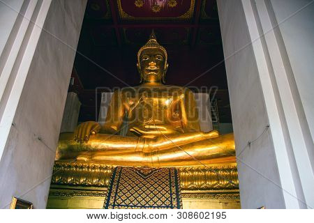 Giant Buddha Image At Wat Mongkol Bophit Temple In Ayutthaya, Thailand.