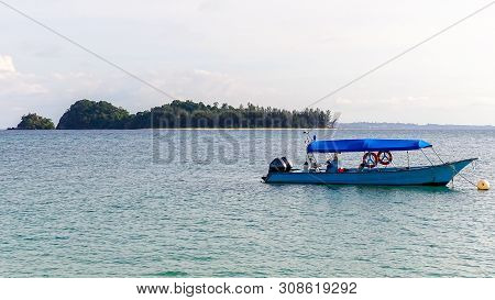 View Of Floating Boat With Background Of Rusukan Kecil Island In Rusukan Besar Island,labuan,malaysi
