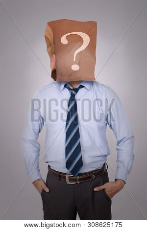 Portrait Of Businessman In Disguise, Wearing Blank Empty Paper Bag Mask Covering His Face With Quest