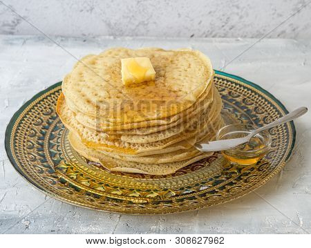 Moroccan Pancakes Baghrir  Beghrir Or Crapes With 1000 Holes Served With Honey And Butter On Grey Ba