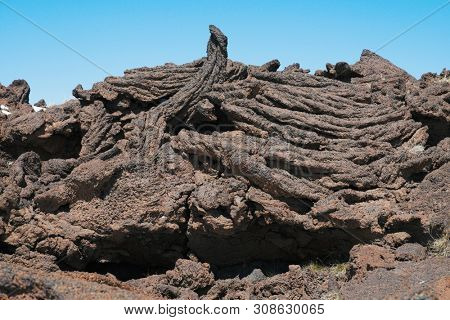 cooled lava flow ropy surface in Etna Park, Sicily