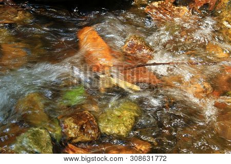 The Clear Water Flows Through The Gravel Are Smooth And Very Cool. Originated From Natural Waterfall