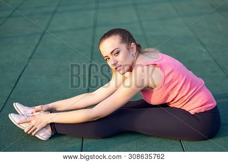 Stretching Fit Or Dancer Woman Doing Exercise In Workout Sports Ground