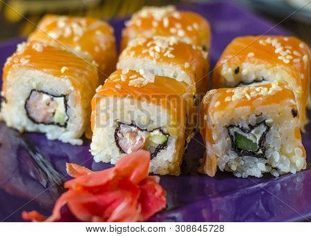Ushi With Red Fish On A Purple Plate