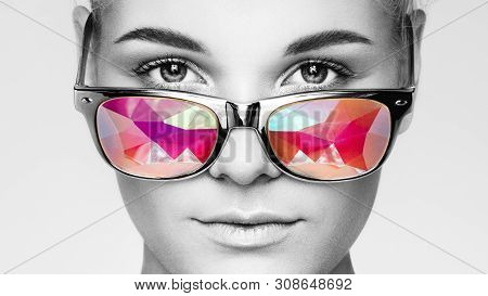 Portrait Of Beautiful Young Woman With Colored Glasses. Beauty Fashion. Perfect Make-up. Colorful De