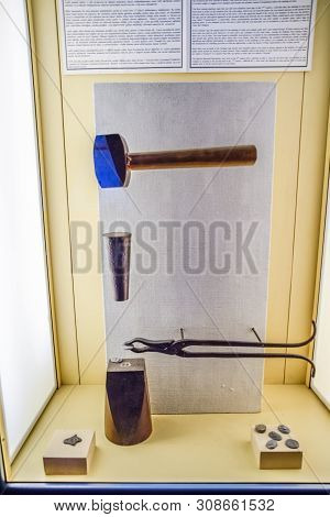 Antalya, Turkey - May 20, 2019: Tools For Minting Coins. Anvil And Vice Making Coins