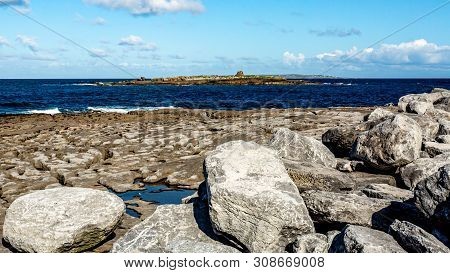 Spectacular Limestone Landscape Discovered And The Ocean In Doolin Bay, Next To The Pier, Wild Atlan