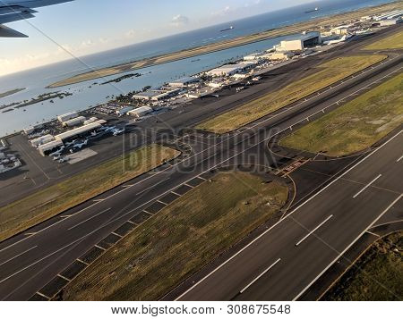 Honolulu - October 25, 2018: Aerial Of Airport Runway, Planes And Plane Hangers At Honolulu Internat