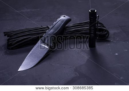 Knife, Paracord And Flashlight. Tools For Night Adventures. Top View On Knife.