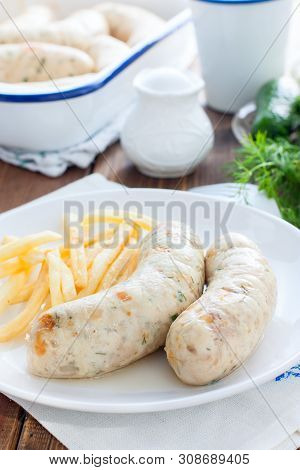 Homemade Kupaty With Chicken And French Fries On A White Plate, Selective Focus