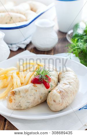 Homemade Kupaty With Chicken And French Fries On A White Plate, Selective Focus