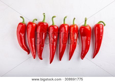 Heap Of Red Pepper On White Background. Top View,  Close-up. Ramiro Pepper. Food Concept.