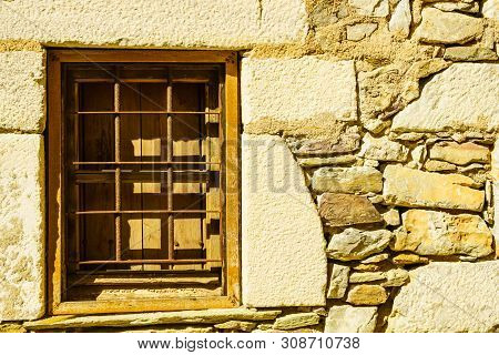 Window Frame Made Of Brown Wood. Old Construction, Ancient Architecture. Enterior Details.