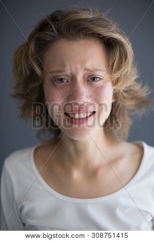 Portrait Of Young Crying Lady Frustratedly Looking In Camera