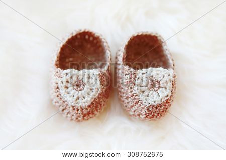 Little Baby Shoes. Hand Knitted First Bootees For Newborn Girl. Crochet Handmade Beige Bootees On Fl