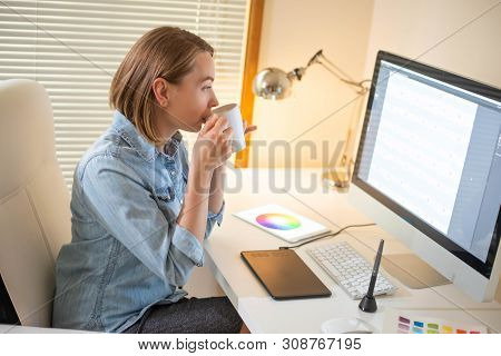 Graphic Designer Works On A Computer Using A Graphic Tablet On A Table. Working With Web Design. Fre