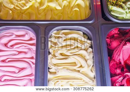 Delicious Ice Cream Of Different Flavors And Colors On A Confectionery Shop