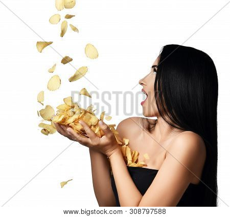 Unhealthy Fast Food Concept. Riffle Potato Chips Falling Into Woman Brunette Hands Isolated On A Whi