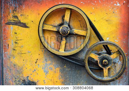 Old Yellow And Orange Iron Wheel With Two Circle