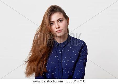 Close Up Portrait Of Beautiful Girl In Blue Casual Shirt With Stars, Looks Sad Or Upset, Has Colm An