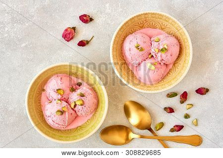 Strawberry Rosewater Ice Cream , Frozen Yogurt With Pistachio And Rosebud. Top View