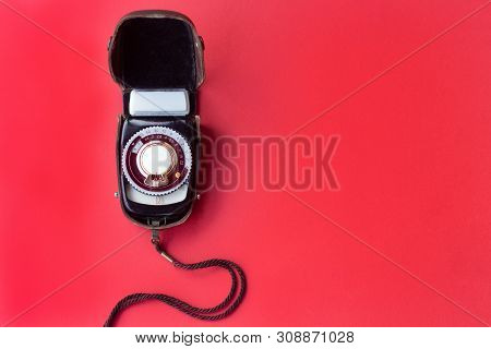 Old Vintage Soviet Exposure Meter With Leather Case On Red Background