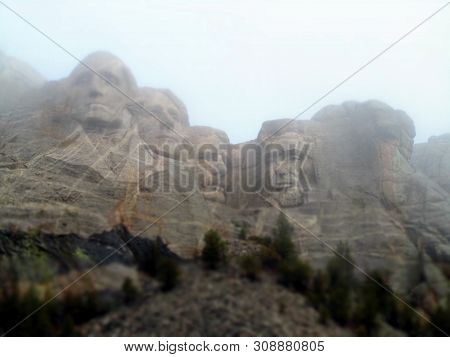 The Carved Faces Of Famous United States Presidents In Mount Rushmore National Memorial On A Foggy C
