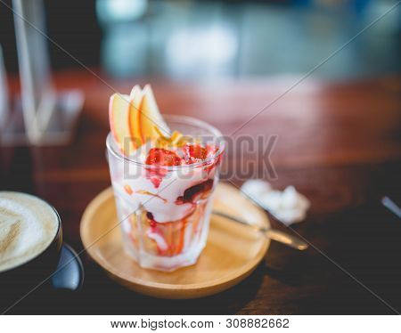 Picture Of A Homemade Fruit Yoghurt With Strawberry Jam, Apple And Conflake