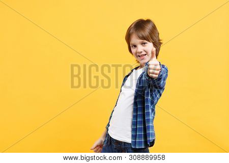 Fun Cheerful Happy Little Kid Boy In Blue Shirt White T-shirt Posing Gesturing Hands Isolated On Yel