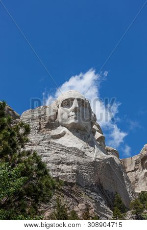 Looking Up At A Carved Likeness Of George Washington, One Of Four United States Presidents Carved In