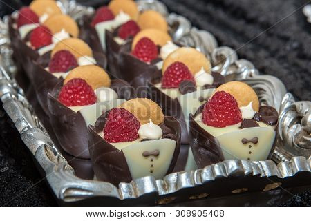 Tuxedo Shapped Yogurt Dip Cups Arranged On Tray And Ready For Party Goer To Eat Delicious Dessert..