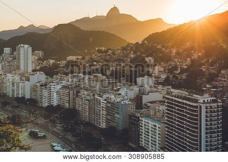 Sunset View In Copacabana, Apartment Buildings, Favela Babilonia, Mountains, And Corcovado
