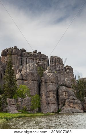 Large Granite Rock Formations Along The Shoreline Of  Sylvan Lake In South Dakota.