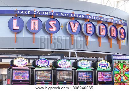 Las Vegas, Nevada, Usa - 13 May, 2019: People Playing Slot Machines At Mccarran International Airpor