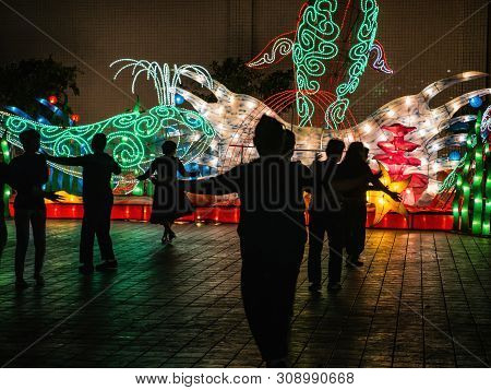 Shantou/china-30 March 2018:silhouette Of Unacquainted Chinese People Danceing In Jinshan Park Of Sh