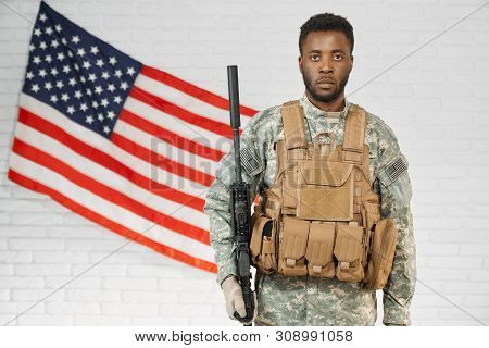 American Ranker Confidently Standing With Weapon At Workplace And Looking At Camera. Young African S