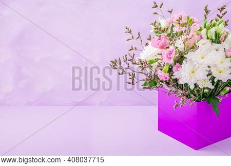 Bouquet Of Beautiful Flower On Pink Background In Box
