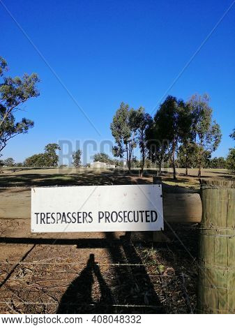 Trespassers Prosecuted Sign On The Gate Of Australian Chicken Farm.